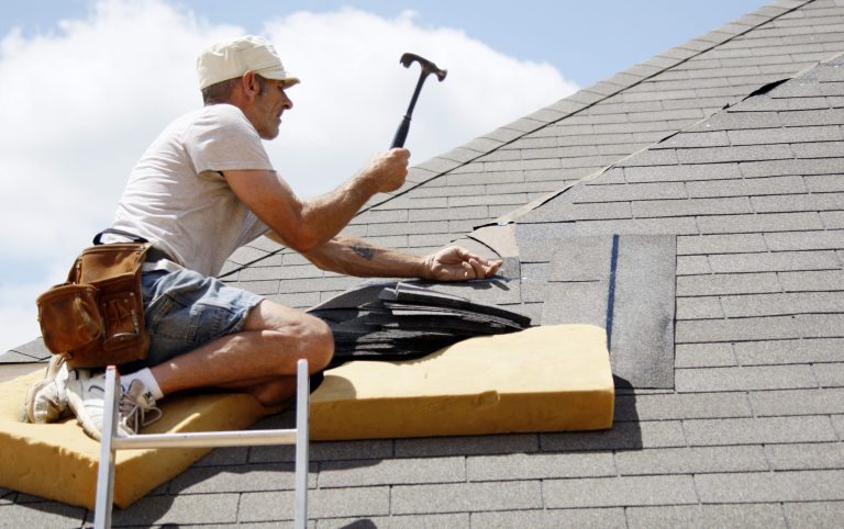   In this Friday, June 1, 2012, photo, Troy Drake hammers a shingle onto the roof of a new house under construction in the Patrick Farms community in Pearl, Miss. Confidence among U.S. builders ticked up in June to a five-year high, an indication that the housing market is slowly improving. (AP Photo/Rogelio V. Solis)  