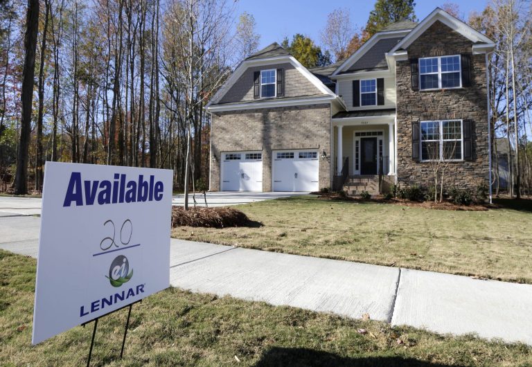 FILE - In this Nov. 14, 2013, file photo, a home is advertised for sale in Matthews, N.C. U.S. home prices barely rose in November from the previous month and year-over-year gains slowed, reflecting declines in sales in the fall, according to a report from real estate data provider CoreLogic, Tuesday, Jan. 7, 2014. (AP Photo/Chuck Burton, File)