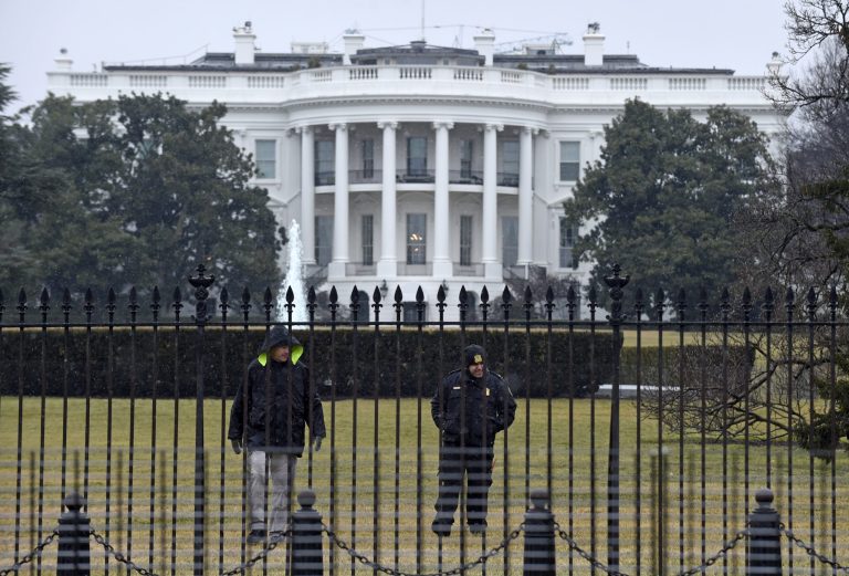 Secret Service officers search the south grounds of the White House in Washington, Monday, Jan. 26, 2015. (AP Photo/Susan Walsh)
