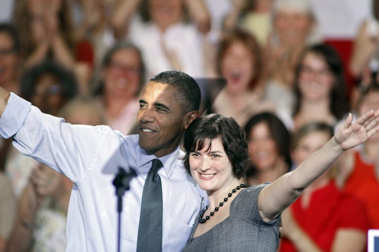 DENVER, CO - AUGUST 8:  Sandra Fluke gets a hug from U.S. President Barack Obama after introducing him to speak during a campaign stop at the Auraria Events Center August 8, 2012 in Denver, Colorado. Fluke is the Georgetown Law Student who testified before Congress earlier this year in favor of insurance coverage of contraception. Obama spoke about the economy and how he says Obamacare has helped women and their access to healthcare. (Photo by Marc Piscotty/Getty Images)