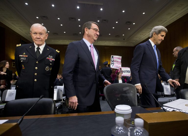 From left, Joint Chief Chairman Gen. Martin Dempsey, Defense Secretary Ash Carter, and Secretary of State John Kerry, arrive on Capitol Hill in Washington, Wednesday, March 11, 2015, to testify before the Senate Foreign Relation Committee. (AP Photo/Pablo Martinez Monsivais)