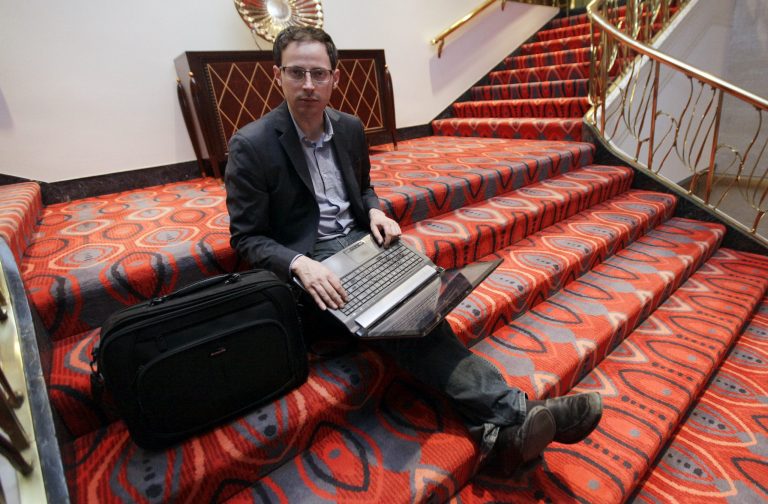 Nate Silver sits on the stairs at Allegro hotel in downtown Chicago, Friday, Nov. 9, 2012. (AP Photo/Nam Y. Huh)