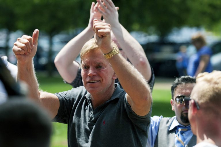 Former Louisiana State Representative David Duke arrives to give remarks after a white nationalist protest was declared an unlawful assembly, Saturday, Aug. 12, 2017, in Charlottesville, Va. The nationalists were holding the rally to protest plans by the city of Charlottesville to remove a statue of Confederate Gen. Robert E. Lee. (Shaban Athuman/Richmond Times-Dispatch via AP)