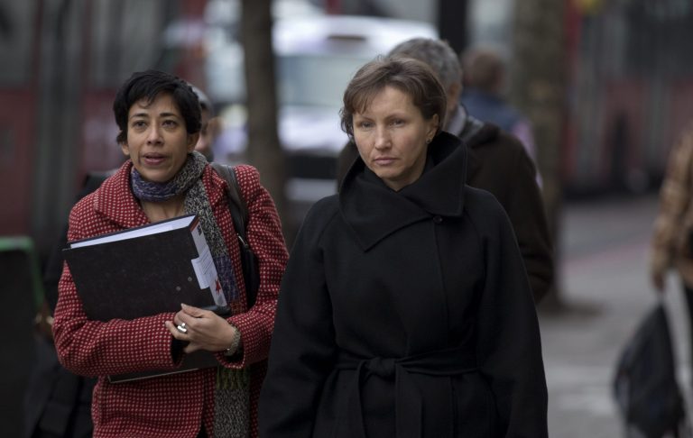   Marina Litvinenko, right, the widow of former Russian intelligence officer Alexander Litvinenko, arrives for the first day of a scheduled two-day Pre-Inquest Review at Camden Town Hall in London, Thursday, Dec. 13, 2012. Alexander Litvinenko died in a London hospital in 2006, with the rare radioactive substance polonium-210 being found in his body. (AP Photo/Matt Dunham)  