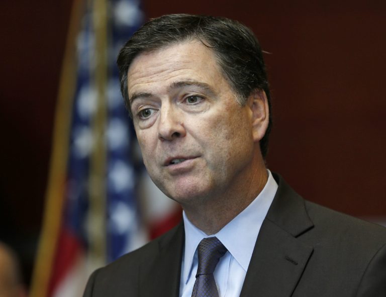 FBI Director James Comey speaks during a news conference at the FBI Albany Field Office on Tuesday, Sept. 23, 2014, in Albany, N.Y. (AP Photo/Mike Groll)