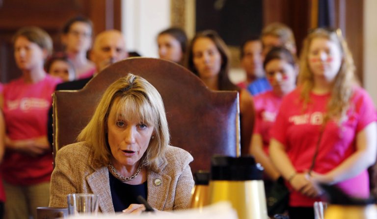 Gov. Maggie Hassan speaks to members of the Executive Council in favor of state funding for Planned Parenthood Wednesday, in Concord, N.H. The Republican-led Executive Council voted against roughly $650,000 in state funding for Planned Parenthood.( AP Photo/Jim Cole)