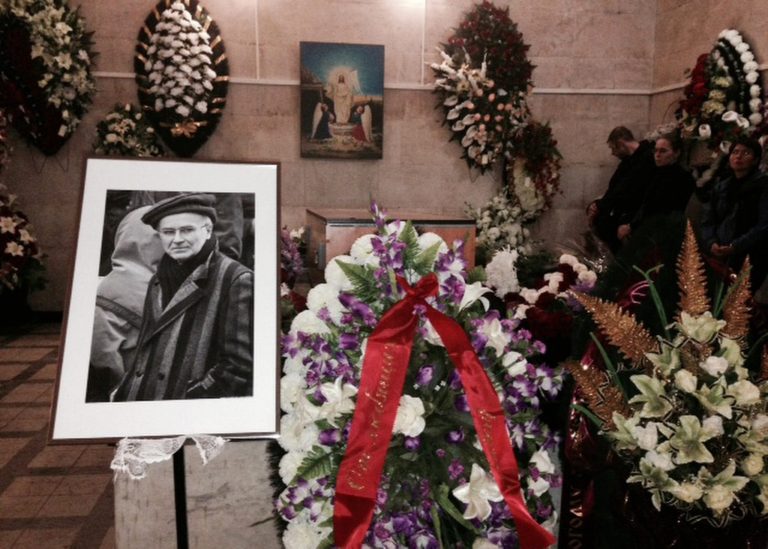 People mourn Andrei Mironov who was killed during fighting in eastern Ukraine, at a memorial service in Moscow, Friday, May 30, 2014. The translator, 60-year-old Andrei Mironov, died along with Italian photographer Andrea Rocchelli, was mourned at his funeral in Moscow on Friday. One of the last political prisoners to be held during the Soviet era, Mironov dedicated the rest of his life to exposing human rights abuses. He also helped foreign journalists covering war and injustice to bring those stories to the world. (AP Photo/Lynn Berry)