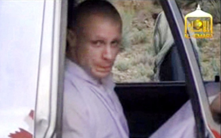 In this image taken from video obtained from Voice Of Jihad Website, which has been authenticated based on its contents and other AP reporting, Sgt. Bowe Bergdahl sits in a vehicle guarded by the Taliban in eastern Afghanistan. The Taliban have released a video showing the handover of Bergdahl to U.S. forces in eastern Afghanistan. The video, emailed to media on Wednesday, shows Bergdahl in traditional Afghan clothing sitting in a pickup truck parked on a hillside. More than a dozen Taliban fighters with machine guns stand around the truck and on the hillside. That feel-good moment in the Rose Garden sure seems like a long time ago. Just a week after the president announced that Sgt. Bowe Bergdahl had been freed in Afghanistan, details emerging about the soldier, the deal and how the rescue came together are only adding to the list of questions. A look at what's known _ and unknown _ about saving Sgt. Bergdahl. (AP Photo/Voice Of Jihad Website via AP video)