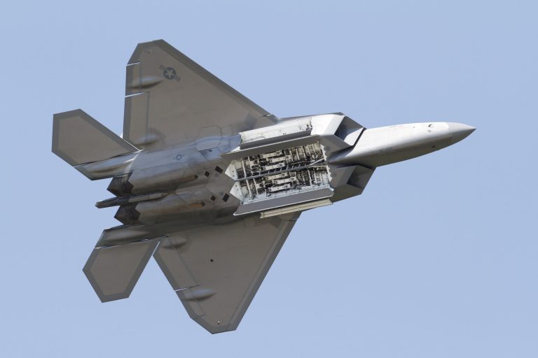   FILE - In this April 30, 2012, file photo, an Air Force F-22 Raptor displays it's weapons bays as it goes through maneuvers during a demonstration at Langley Air Force Base in Hampton, Va., Monday, April 30, 2012. Two members of Congress said Thursday, June 14, 2012, that new information provided by the Air Force shows an oxygen-deficit problem on F-22 fighter jets is worse than previously disclosed. (AP Photo/Steve Helber, File)  