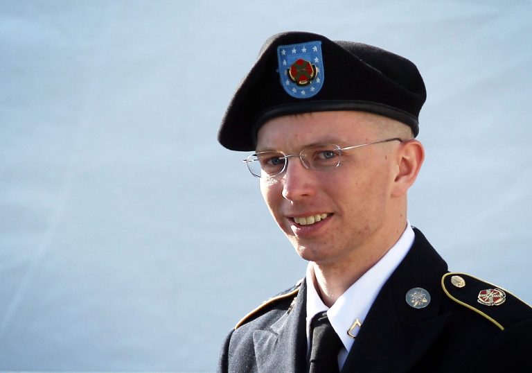 FORT MEADE, MD - JUNE 06:  U.S. Army Private Bradley Manning is escorted as he leaves a military court at the end of the first of a three-day motion hearing June 6, 2012 in Fort Meade, Maryland. Manning, an Army intelligence analyst who has been accused of passing thousands of diplomatic cables and intelligence reports to the whistleblowing website WikiLeaks and facing 22 charges including aiding the enemy, returned to the court room to ask for dismissal of 10 of the charges.  (Photo by Alex Wong/Getty Images)