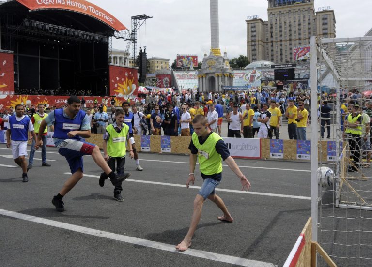   Soccer fans from different countries play street matches in the Euro 2012 fan zone in the Ukrainian capital to combat racism and promote tolerance at the Fan Zone during the Euro 2012 soccer championship in Kiev Ukraine, Friday, June 15, 2012.(AP Photo/Sergei Chuzavkov)  
