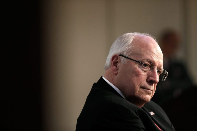 Former Vice President Dick Cheney listens as his wife, Lynne Cheney, speaks