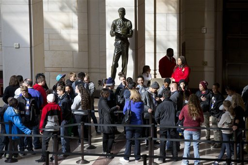 Tourists line up at the Capitol Visitors Center on Capitol Hill. Although the U.S. Capitol remains open to tours for the public, fewer entrances to the Capitol complex are open, leading to long lines for tourists and employees alike. (AP Photo/J. Scott Applewhite)