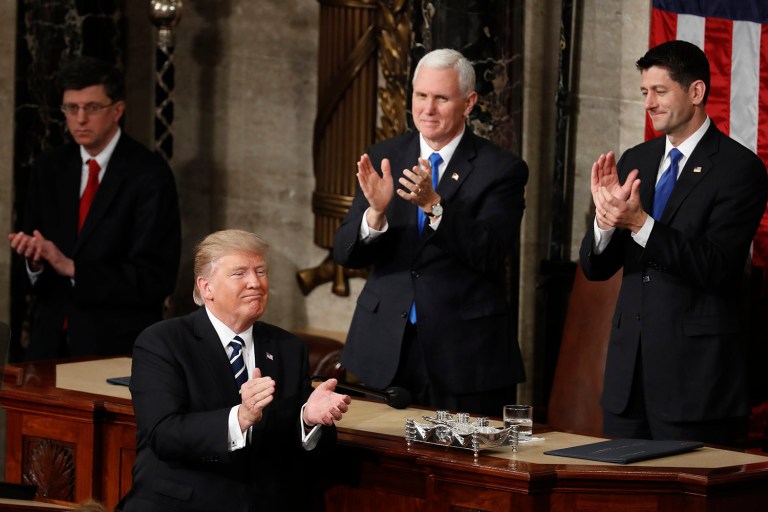 President Donald Trump, Vice President Mike Pence and House Speaker Paul Ryan of Wis. applaud on Capitol Hill in Washington, Tuesday, Feb. 28, 2017, following the president's address to a joint session of Congress. (AP Photo/Alex Brandon)