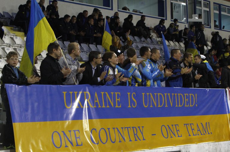 Ukrainians with a banner reading 