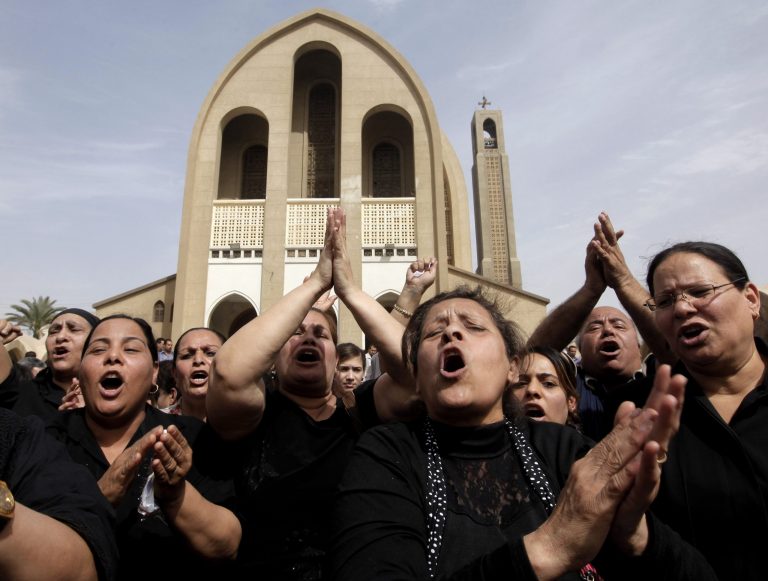 Egyptian Christians chant anti-Muslim Brotherhood slogans following a funeral service at the Saint Mark Coptic cathedral in Cairo, Egypt, Sunday, April 7, 2013. Several Egyptians including 4 Christians and a Muslim were killed in sectarian clashes before dawn in Qalubiya, just outside of Cairo on Saturday, April 6, 2013. (AP Photo/Amr Nabil)