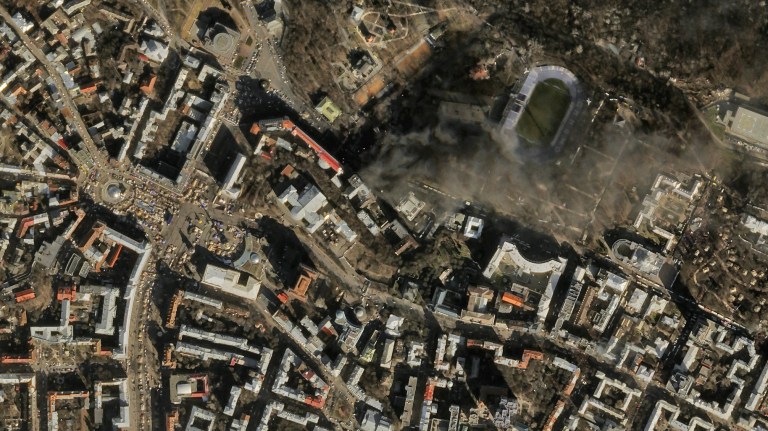FILE - In this file satellite image provided by Skybox Imaging and taken by SkySat-1 on Tuesday, Feb. 18, 2014 at 11:10 a.m. local time, smoke rises from the site of anti-government protests, upper center, in Kiev, Ukraine. Google is buying Skybox Imaging in a deal that could serve as a launching pad for the Internet company to send its own fleet of satellites to take aerial pictures and provide online access to remote areas of the world. (AP Photo/Skybox Imaging, File) MANDATORY CREDIT