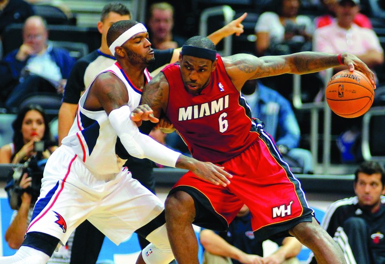 Todd Kirkland/AP
Miami Heat forward LeBron James looks to repeat as NBA champion, NBA Finals MVP and league MVP. He averaged 27.1 points, 7.9 rebounds and 6.2 assists last season.SClB