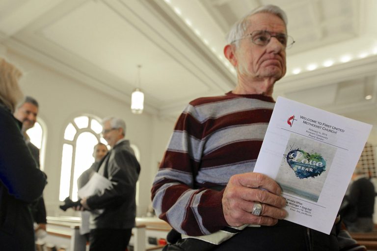 In this Thursday, Feb. 6, 2014 photo, Ron McKenzie holds a prayer program titled 