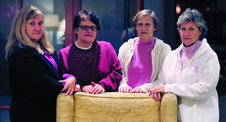 The Melnick sisters, who are suing Eli Lilly and Co. alleging that a synthetic estrogen known as DES caused them all to get breast cancer, pose at their hotel in Boston, Monday evening, Jan. 7, 2013. Testimony is set to begin in their federal lawsuit against the drug maker on Tuesday Jan. 8th. From left are Francine Melnick, Andrea Andrews, Donna McNeely and Michele Fecho. (AP Photo/Charles Krupa)