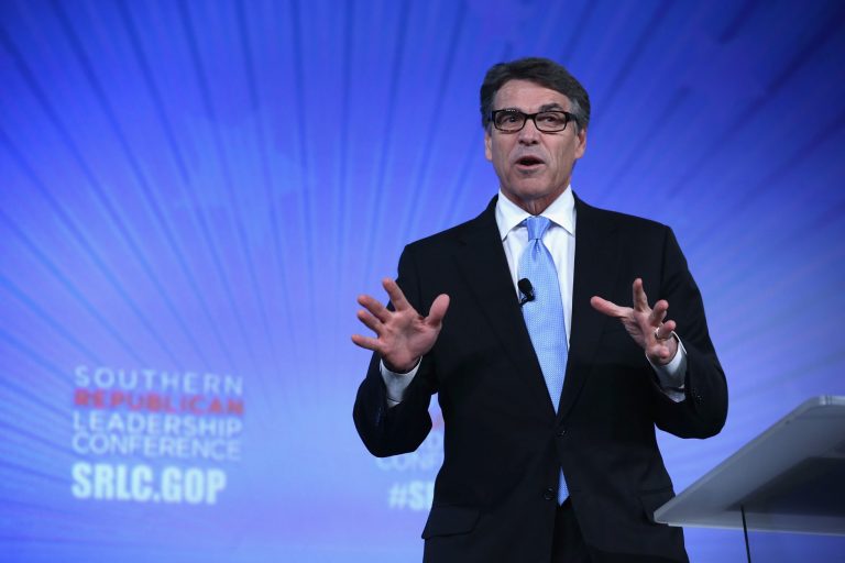 Rick Perry, like other 2016 hopefuls, attacked Hillary Clinton by tying her to Presidents Obama and Carter. (Getty) Â 