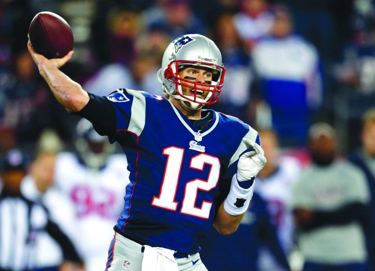 Jim Rogash/Getty Images
Quarterback Tom Brady completed 25 of 40 passes for 344 yards and three touchdowns as the Patriots beat the Texans on Sunday.