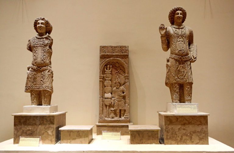 Stone figures depicting the family of Sanatruq are showcased at the Iraqi National Museum in Baghdad, Iraq, Thursday, Aug 21, 2014. Two renovated halls adorned mainly with rare life-size stone statues were inaugurated at the Iraqi National Museum on Thursday geared toward honoring the 5,000 year legacy of the ancient city of Hatra. (AP Photo/Hadi Mizban)