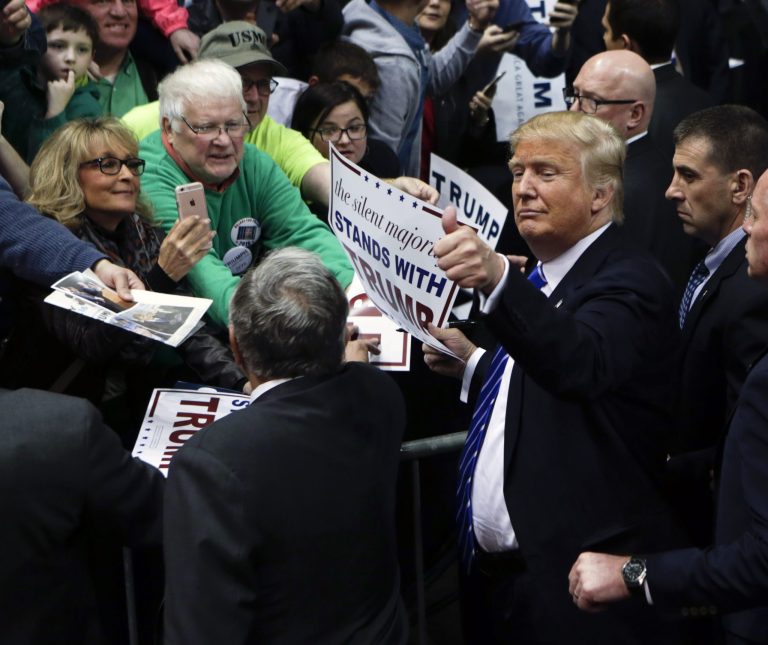 Republican presidential candidate Donald Trump gives a thumbs up after a rally at the Times Union Center on Monday, April 11, 2016, in Albany, N.Y. (AP Photo/Mike Groll)
