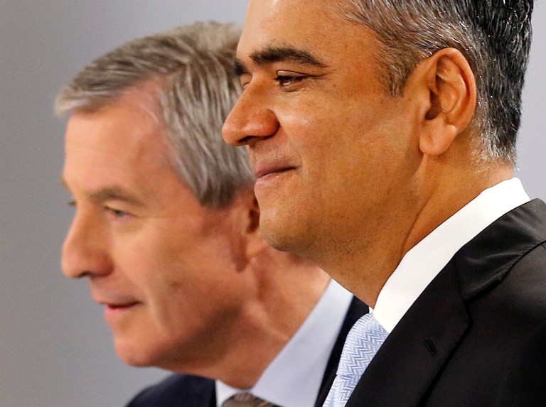 CEOs of Deutsche Bank Anshu Jain, right, and Juergen Fitschen stand together prior to the annual press conference in Frankfurt, Germany, Wednesday, Jan. 29, 2014. Germany's biggest bank had a surprise loss of 965 million euros (US dollar 1.32 billion) in the fourth quarter, as earnings were burdened by 528 million in costs for court settlements and investigations into alleged past misconduct in the fourth quarter. (AP Photo/Michael Probst)