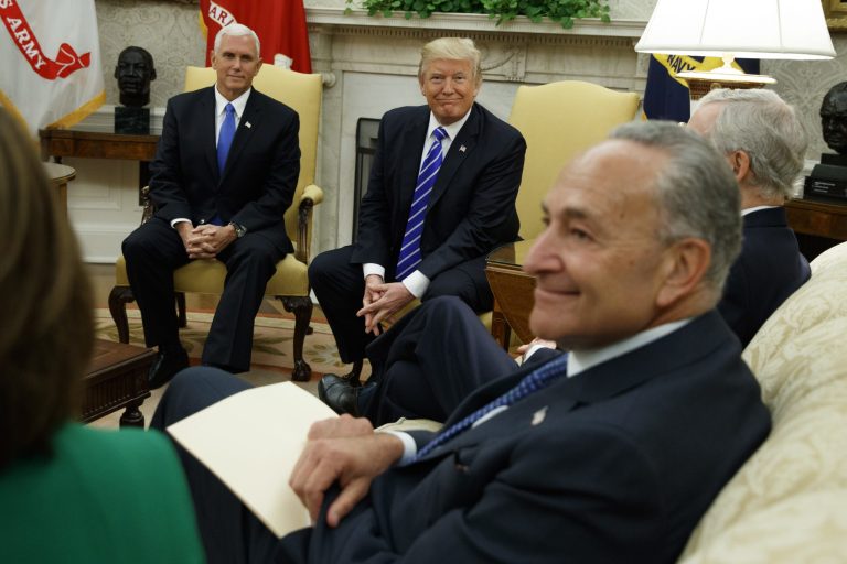 Vice President Mike Pence looks on with President Donald Trump during a meeting with Senate Minority Leader Chuck Schumer, D-N.Y., House Minority Leader Nancy Pelosi, left, and other congressional leaders in the Oval Office of the White House, Wednesday, Sept. 6, 2017, in Washington. (AP Photo/Evan Vucci)