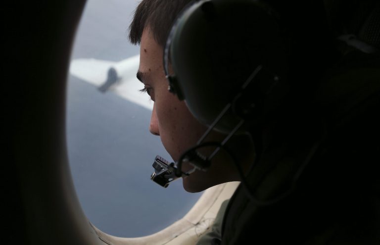 Sgt. Matthew Falanga on board a Royal Australian Air Force AP-3C Orion, search for the missing Malaysia Airlines flight MH370 in southern Indian Ocean, Australia, Saturday, March 22, 2014.  Frustration grew Saturday over the lack of progress tracking down two objects spotted by satellite that might be Malaysia Airlines Flight 370, with a Malaysian official expressing worry that the search area will have to be widened if no trace of the plane is found. (AP Photo/Rob Griffith, Pool)