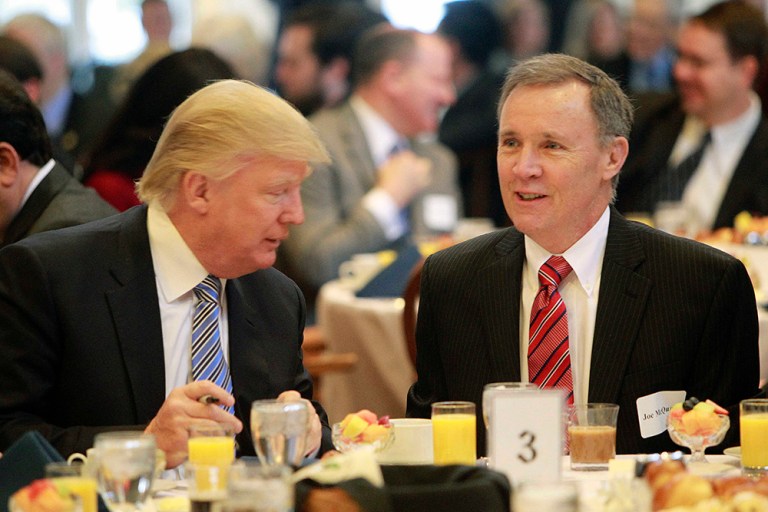 In this Jan. 21, 2014 file photo, Trump, left, talks with New Hampshire Union Leader Publisher Joe McQuaid. In the last couple of weeks the two have been feuding with each other in speeches and in print. (AP File Photo/Jim Cole)
