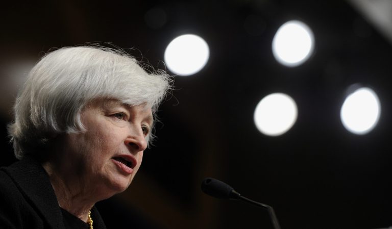 Federal Reserve Chair Janet Yellen speaks at the International Monetary Fund in Washington, Wednesday, July 2, 2014.  Yellen said she doesn't see a need for the Fed to start raising interest rates to address the risk that extremely low rates could destabilize the financial system.  (AP Photo/Susan Walsh)