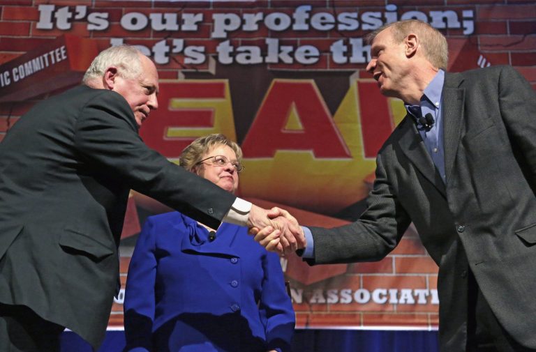 FILE - In this April 11, 2014 file photo, Illinois Gov. Pat Quinn, left, and his Republican rival, venture capitalist Bruce Rauner, shake hands after they appeared together at the annual meeting of the Illinois Education Association in Chicago. Quinn and Rauner have agreed to three traditional debates before the November election. (AP Photo/M. Spencer Green, File)