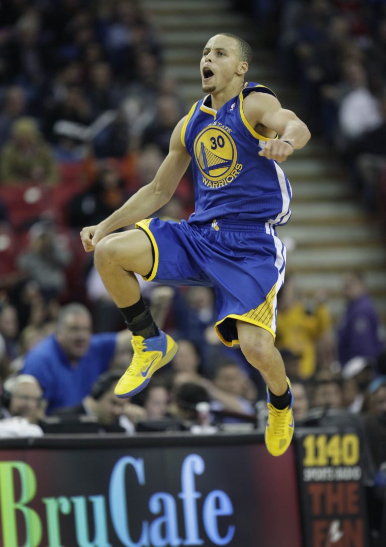   Golden State Warriors guard Stephen Curry reacts after scoring in the fourth quarter against the Sacramento Kings in an NBA basketball game in Sacramento, Calif., on Wednesday, Dec. 19, 2012. The Kings won 131-127.(AP Photo/Steve Yeater)  
