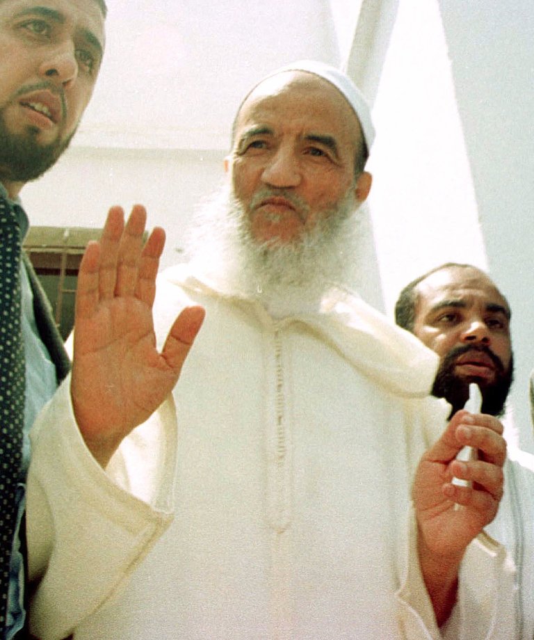   FILE - Morocco's main Islamic leader Abdessalam Yassine gestures in his local mosque during the Friday prayer, in this May 19, 2000 file photo, in Sale, on the outskirts of the Moroccan capital Rabat. The daughter of the founder of Morocco's most powerful religious opposition movement says that her father has died aged 84 on Thursday Dec. 13 2012. (AP Photo/Jalil Bounhar)  