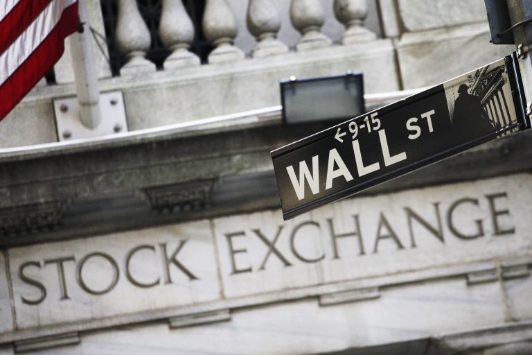 FILE - This July 16, 2013 file photo shows a Wall Street street sign outside the New York Stock Exchange in New York. Asian stocks erased gains and European markets were lower Thursday Sept. 11, 2014 as investors tried to second guess the Federal Reserve's thinking on the timing of an interest rate hike.  (AP Photo/Mark Lennihan, File)