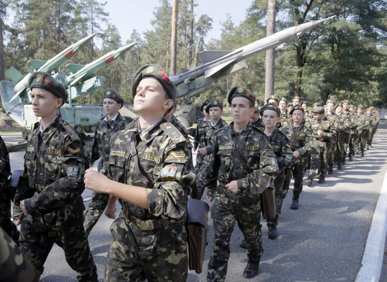 Students march during a military training exercise in a military school in Boyarka, near Kiev, Ukraine, Tuesday Sept. 9, 2014. The state order for military experts has doubled this year in comparison with 2013, with 15 percent more young people requesting military education. (AP Photo/Efrem Lukatsky)