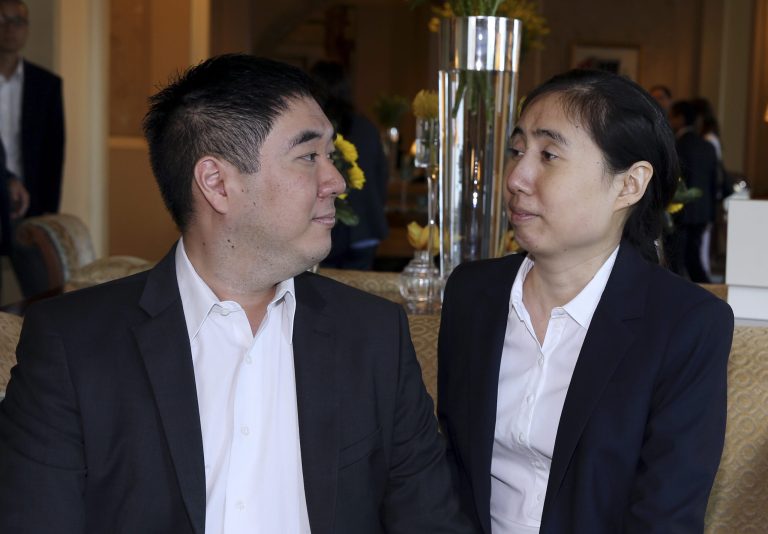 American couple Grace and Matthew Huang, sentenced to jail over charges they starved their 8-year-old adopted daughter to death, talk before they meet with U.S. Ambassador to Qatar, Dana Shell Smith, at a hotel in Doha, Qatar, Sunday, Oct. 19, 2014. The American couple were released from prison in November, but were banned from leaving Qatar during their trial. Their appeal begins on Monday. (AP Photo/Osama Faisal)