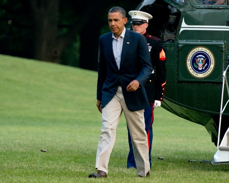 WASHINGTON, DC - JUNE 29:  U.S. President Barack Obama walks on the South Lawn of the White House after arriving aboard Marine One June 29, 2012 in Washington, D.C. The president was returning from a trip to Colorado Springs, Colorado to view damage from the wildfires raging there and to thank emergency workers for their efforts.  (Photo by Ron Sachs-Pool/Getty Images)