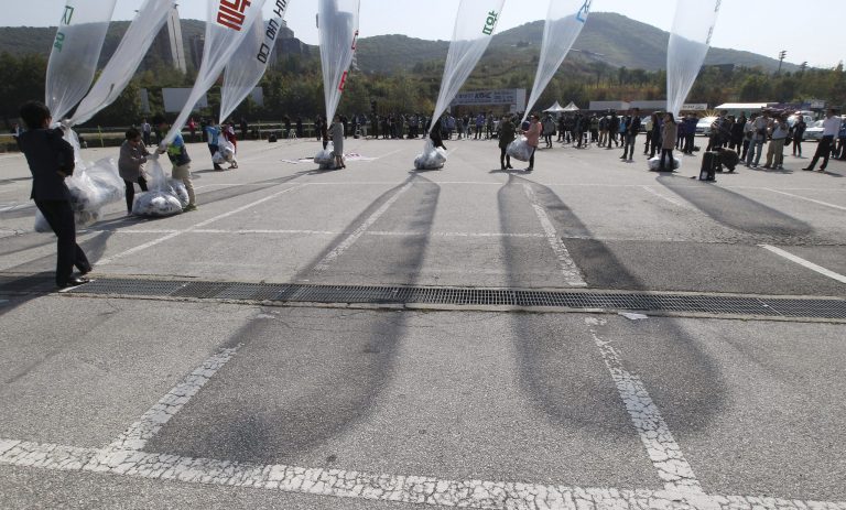 North Koran defectors prepare to release balloons carrying leaflets condemning North Korean leader Kim Jong Un and his government's policies in Paju, near the border with North Korea, South Korea, Friday, Oct. 10, 2014. For the first time in three years, North Korean leader Kim Jong Un didn't appear at a celebration of the anniversary of the founding of the ruling Workers' Party on Friday, further increasing speculation that something is amiss with the authoritarian leader who hasn't been seen publicly in more than a month. (AP Photo/Ahn Young-joon)