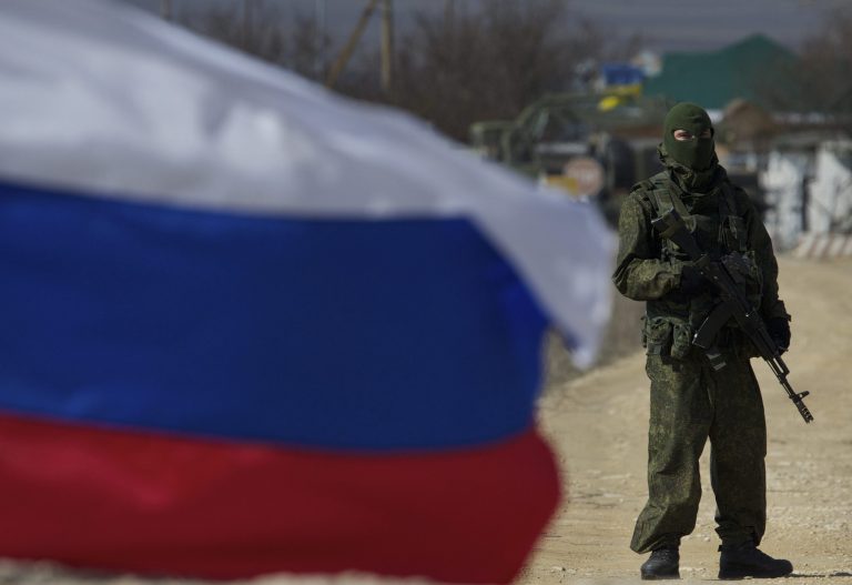 Pro-Russian soldiers block the Ukrainian naval base in the village of Novoozerne, some 91 km west of Crimean capital Simferopol, Ukraine, on Monday, March 3, 2014. (AP Photo/Ivan Sekretarev)
