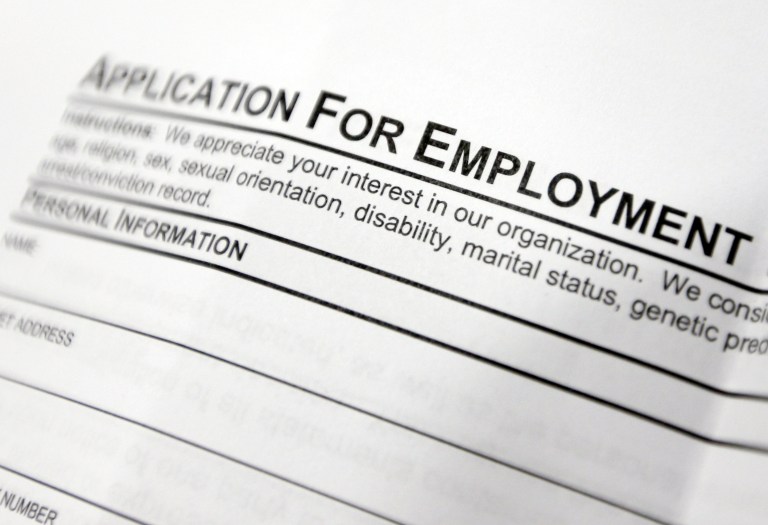 FILE - This April 22, 2014, file photo shows an employment application form on a table during a job fair at Columbia-Greene Community College in Hudson, N.Y.  The Labor Department reports the number of people who applied for unemployment benefits last week on Thursday, July 10, 2014. (AP Photo/Mike Groll, File)
