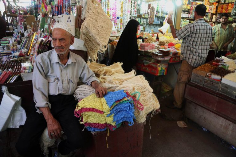 In this photo taken on June 17, 2014, people shop at a market in Baghdad, Iraq. While the Iraqi capital is not under any immediate threat of falling to the Sunni militants who have captured a wide swath of the country's north and west, battlefield setbacks and the conflict's growing sectarian slant is turning this city of 7 million into an anxiety-filled place waiting for disaster to happen. (AP Photo/Karim Kadim)