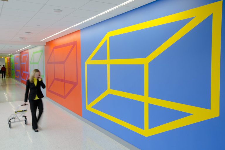   In this Monday, Dec. 10, 2012 photo, a person walks past an installation titled Wall Drawing #972 by artist Sol LeWitt at the Einstein Medical Center Montgomery, in Norristown, Pa. The new hospital in suburban Philadelphia is now home to one of late artist's famous geometric wall drawings acquired via a 25-year loan from the artist's estate. (AP Photo/Matt Rourke)  