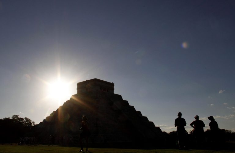   FILE - The sun sets behind the Kukulkan Pyramid in the ancient Mayan city of Chichen Itza in Mexico on Thursday, Dec. 20, 2012. A study published online Thursday, Aug. 1, 2013 by the journal Science says as the world gets warmer, people are more prone to get hot under the collar. Scientists found that aggressive acts like violent crimes and wars become more likely with each added degree. Solomon Hsiang, author of the study, pointed to the collapse of the Mayan civilization that coincided with periods of historic drought about 1200 years ago. (AP Photo/Israel Leal)  