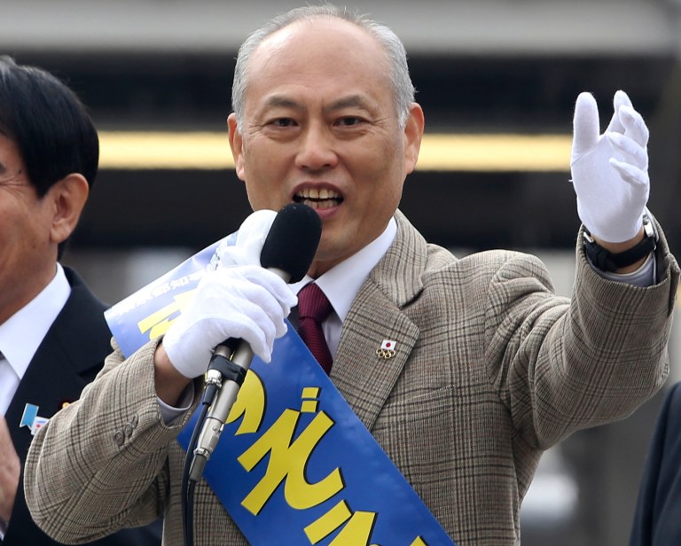 FILE - In this Jan. 25, 2014 file photo, former Health Minister Yoichi Masuzoe, a candidate for the Tokyo gubernatorial election, delivers a speech during his election campaign rally in Tokyo.  Two charismatic former prime ministers joining forces on a rare anti-nuclear power ticket are pitted against Masuzoe and a human-rights activist in the election to lead Japan's capital.  Japanese media polls say Masuzoe, more moderate on nuclear power, is leading. A lawyer known for human rights cases and a former military officer are also running.  (AP Photo/Koji Sasahara, File)