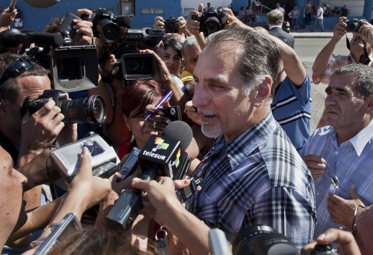 Rene Gonzalez speaks to reporters after leaving the U.S. Interests Section after starting paperwork to his renounce his U.S. citizenship in Havana, Cuba, Monday, May 6, 2013. Gonzalez, a Cuban spy who spent 13 years in a U.S. prison, renounced his American citizenship Monday, part of a deal that allows him to avoid returning to the United States to serve out the remainder of his probation. (AP Photo/Ramon Espinosa)