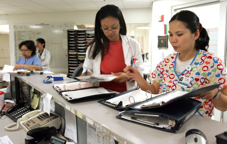 A nurse and physician's assistant fill out paperwork to admit a patient at the Prince George's Hospital Center emergency room in Cheverly. The University of Maryland Medical System is slated to begin running the emergency rooms at all county hospitals. (Examiner file photo)