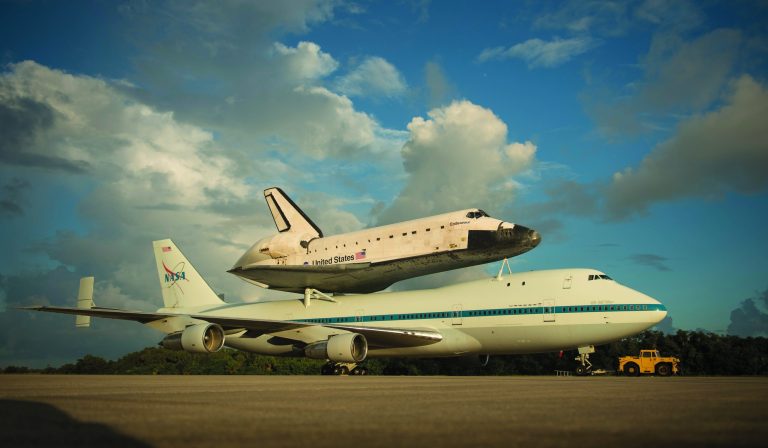 This photo provided by NASA shows space shuttle Endeavour atop NASA's Shuttle Carrier Aircraft, or SCA, at the Shuttle Landing Facility at NASA's Kennedy Space Center on Monday, Sept. 17, 2012 in Cape Canaveral, Fla. The beginning of Endeavour's final flight to California has been postponed because of weather along the flight route. NASA had planned for the 747 carrying the shuttle to take off from Kennedy Space Center on Monday. (AP Photo/NASA, Bill Ingalls)
